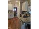 Kitchen area showcasing granite countertops, cabinetry and an open floor plan at 1655 Kingfisher Ct, Nashville, NC 27856
