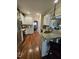 Traditional kitchen features wood floors, granite countertops, and stainless steel appliances at 1655 Kingfisher Ct, Nashville, NC 27856