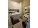 Bright laundry room features a sink, cabinets, washer, and dryer at 1655 Kingfisher Ct, Nashville, NC 27856