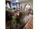 Spacious living room with a fireplace, comfortable seating, and a patterned rug at 1655 Kingfisher Ct, Nashville, NC 27856
