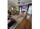 Comfortable living room with hardwood floors, fireplace and a television at 1655 Kingfisher Ct, Nashville, NC 27856