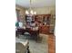 Elegant home office with custom cabinetry, hardwood floors, and a large desk at 1655 Kingfisher Ct, Nashville, NC 27856