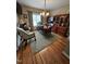 Spacious home office featuring hardwood floors and custom built-in shelving at 1655 Kingfisher Ct, Nashville, NC 27856