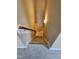 Carpeted stairs with a wooden handrail lead to the lower level at 1655 Kingfisher Ct, Nashville, NC 27856