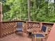 Secluded backyard deck with lattice privacy fence featuring an outdoor seating area at 1707 Falls Church Rd, Raleigh, NC 27609