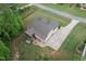 Aerial view of backyard featuring a screened in porch and concrete patio at 175 Lockamy Ln, Youngsville, NC 27596