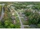 Aerial view of a neighborhood surrounded by lush greenery and winding streets at 175 Lockamy Ln, Youngsville, NC 27596