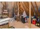 Unfinished attic space filled with storage items and wooden framing structure at 175 Lockamy Ln, Youngsville, NC 27596