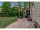 Backyard with a firepit, screened-in porch, and cozy seating area at 175 Lockamy Ln, Youngsville, NC 27596