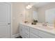 Bathroom featuring double sink vanity with white cabinets and a large mirror at 175 Lockamy Ln, Youngsville, NC 27596