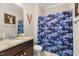 Bathroom featuring a wooden deer decoration and a blue camo shower curtain at 175 Lockamy Ln, Youngsville, NC 27596