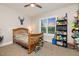 Comfortable bedroom with a ceiling fan, natural light from a window, and a shelf for decor at 175 Lockamy Ln, Youngsville, NC 27596