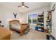 Comfortable bedroom with a ceiling fan, natural light from a window, and a shelf for decor at 175 Lockamy Ln, Youngsville, NC 27596