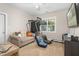 Cozy bedroom with gaming chairs, seating area, and television for entertainment at 175 Lockamy Ln, Youngsville, NC 27596