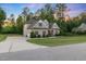 Beautiful home with a well-manicured lawn and a spacious driveway at 175 Lockamy Ln, Youngsville, NC 27596