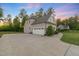 Charming home featuring a large driveway with an attached two-car garage at 175 Lockamy Ln, Youngsville, NC 27596