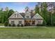 Charming two-story home with inviting front porch, landscaped yard and manicured lawn at 175 Lockamy Ln, Youngsville, NC 27596