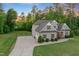 Beautiful home with an attached two-car garage, a large lawn, and mature landscaping at 175 Lockamy Ln, Youngsville, NC 27596