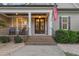 Charming front porch entrance featuring brick steps and decorative plants at 175 Lockamy Ln, Youngsville, NC 27596