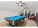 Spacious game room with a pool table, bar area, TV, and ample space for entertainment at 175 Lockamy Ln, Youngsville, NC 27596