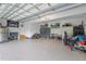 Spacious garage with epoxy floors, storage cabinets and mounted TV's at 175 Lockamy Ln, Youngsville, NC 27596