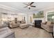 Comfortable living room with neutral tones, a fireplace, and a view into the kitchen at 175 Lockamy Ln, Youngsville, NC 27596