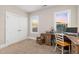 Bright home office with desk, chair, closet, and natural light from multiple windows at 175 Lockamy Ln, Youngsville, NC 27596