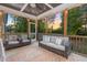 Relaxing screened porch featuring outdoor seating and sunset views at 175 Lockamy Ln, Youngsville, NC 27596