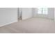 Bright bedroom with neutral carpet, white walls, and a window offering ample natural light at 1907 Hinesley Dr, Durham, NC 27703