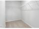 Spacious walk-in closet with shelving and neutral carpet at 1913 Hinesley Dr, Durham, NC 27703