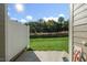 Backyard patio with a view of the lawn and mature trees at 1915 Hinesley Dr, Durham, NC 27703