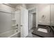 Spacious bathroom featuring tub/shower combo and stone vanity at 1915 Hinesley Dr, Durham, NC 27703