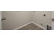 Functional laundry area with tile flooring and neutral paint at 1915 Hinesley Dr, Durham, NC 27703