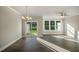 Bright living room with sliding door access to backyard and large windows providing plenty of sunlight at 1915 Hinesley Dr, Durham, NC 27703