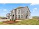 New two-story home boasts stone accents, a covered porch, and a well-maintained lawn in a community setting at 1917 Hinesley Dr, Durham, NC 27703