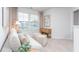 Comfortable living room with a sofa, neutral decor, a side table, and bright natural lighting at 1917 Hinesley Dr, Durham, NC 27703