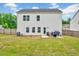 Expansive backyard with green lawn, patio seating area, and secure fencing, perfect for outdoor activities and relaxation at 200 Chateau Way, Angier, NC 27501