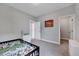 Bright bedroom with neutral walls, carpet flooring, and ensuite doorway for a calm, private retreat at 200 Chateau Way, Angier, NC 27501