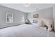Neutral bedroom with gray walls and carpet featuring two windows and a tent at 200 Chateau Way, Angier, NC 27501