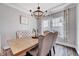 Stylish dining area featuring a wooden table, upholstered chairs, and decorative window treatments at 200 Chateau Way, Angier, NC 27501