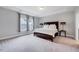 Spacious main bedroom with tray ceiling featuring a large window and a bed with storage drawers at 200 Chateau Way, Angier, NC 27501