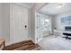 Bright office space featuring French doors, neutral carpeting, and a well-lit work area at 200 Chateau Way, Angier, NC 27501
