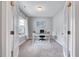 Well-lit home office with French doors, neutral walls, a desk, and a comfortable office chair at 200 Chateau Way, Angier, NC 27501