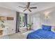 Bright bedroom with neutral walls, carpet, and a bench seat under the window at 2006 Keokuk Ct, Apex, NC 27523