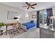 Bright bedroom with a workspace featuring a ceiling fan and large window at 2006 Keokuk Ct, Apex, NC 27523