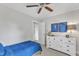Cozy bedroom features a ceiling fan and a white dresser with stylish decor at 2006 Keokuk Ct, Apex, NC 27523