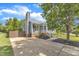 Beautiful home with a chimney, driveway, manicured lawn, and charming front porch with white railings at 2006 Keokuk Ct, Apex, NC 27523