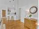 Bright kitchen with white cabinets, stainless steel appliances, and a breakfast bar at 2006 Keokuk Ct, Apex, NC 27523