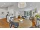 Open living area with hardwood floors, white trim, and eat in breakfast area at 2006 Keokuk Ct, Apex, NC 27523