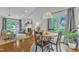 Bright open living and dining area with hardwood floors and large windows at 2006 Keokuk Ct, Apex, NC 27523